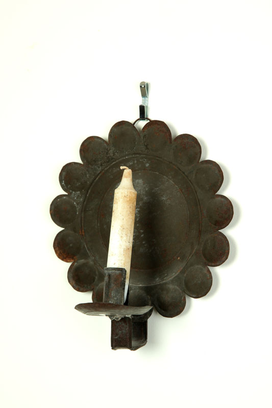 Appraisal: WALL SCONCE American th century tin Stylized flower back and