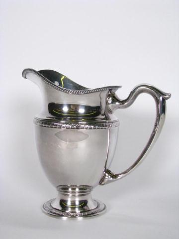 Appraisal: Sterling Silver Water Pitcher '' high with ribbed design hallmarked