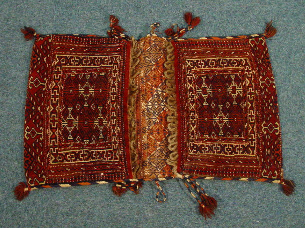 Appraisal: Pair of mats profusely decorated with colourful flowers a smaller