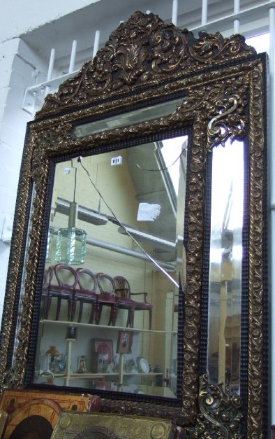 Appraisal: A Flemish ebonised and brass mounted wall mirror early th