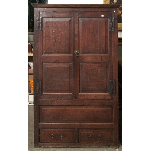 Appraisal: A joined oak cupboard enclosed by a pair of doors