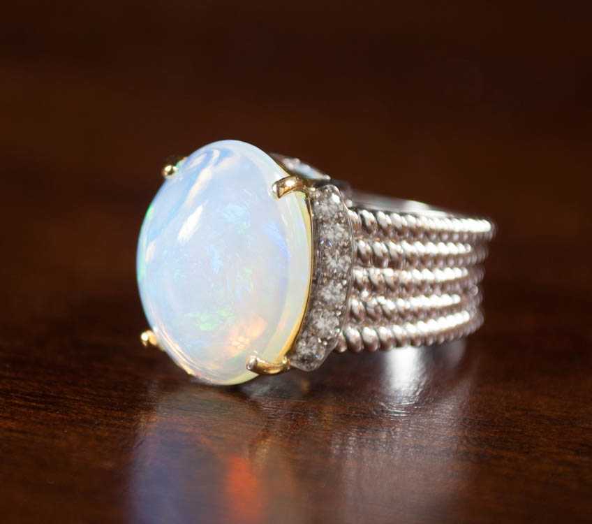 Appraisal: JELLY OPAL DIAMOND AND FOURTEEN KARAT GOLD RING The white