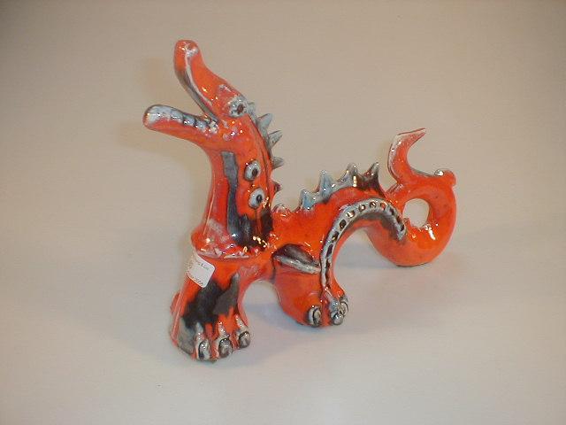 Appraisal: A stylised pottery figure of a dragon coloured in bright