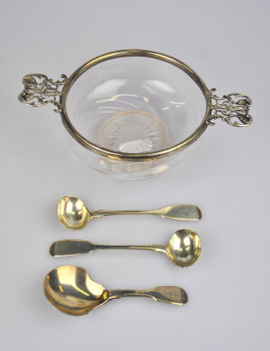 Appraisal: A glass bowl with silver rim and twin pierced handles