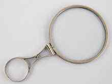 Appraisal: A white metal tests silver late Georgian magnifying glass approx