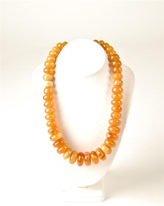 Appraisal: A Graduated Amber Roundel Necklace long with simple hook and