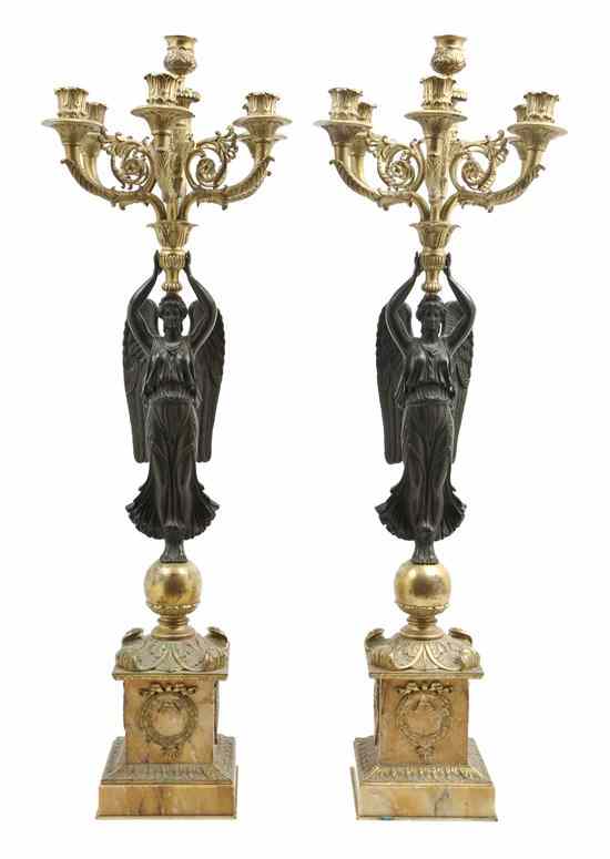 Appraisal: A Pair of Empire Gilt and Patinated Bronze Seven-Light Candelabra