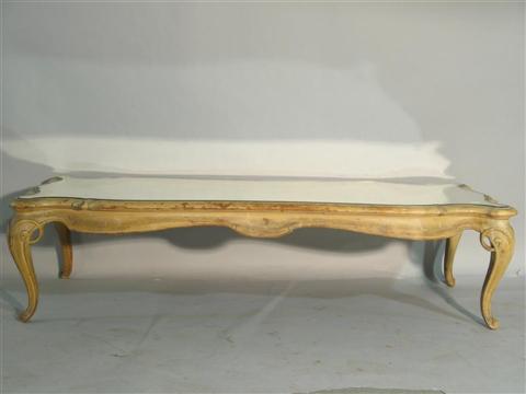 Appraisal: FRENCH PROVENCIAL STYLE PAINTED COFFEE TABLE Twentieth century the shaped