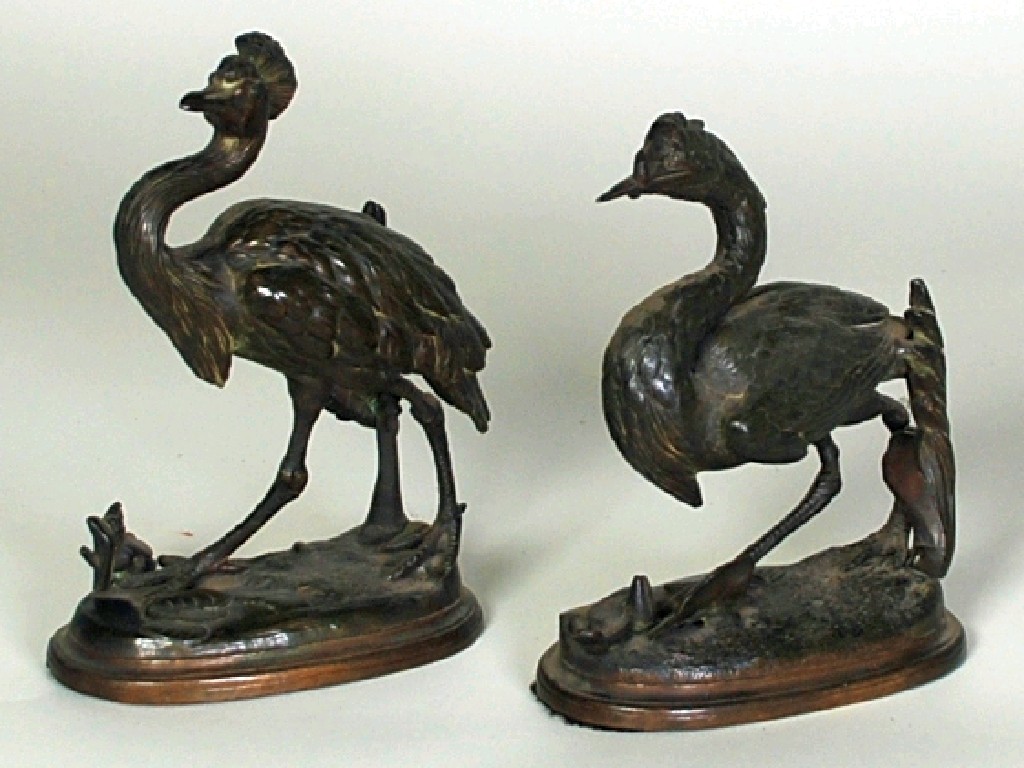 Appraisal: PAIR OF SPELTER MODELS OF WADING BIRDS on oval moulded