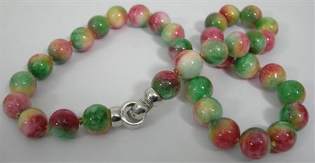 Appraisal: A rainbow coloured jade bead necklace composed of rosy-apple coloured