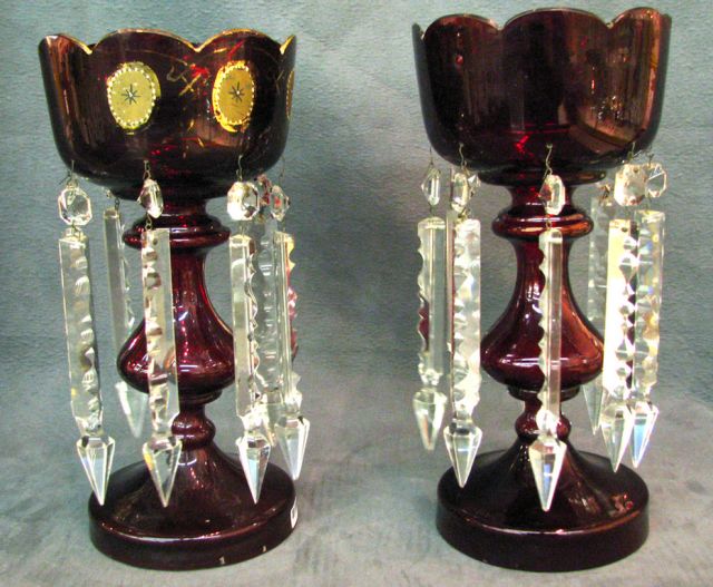 Appraisal: Pair of Victorian ruby glass lustres with large prisms and