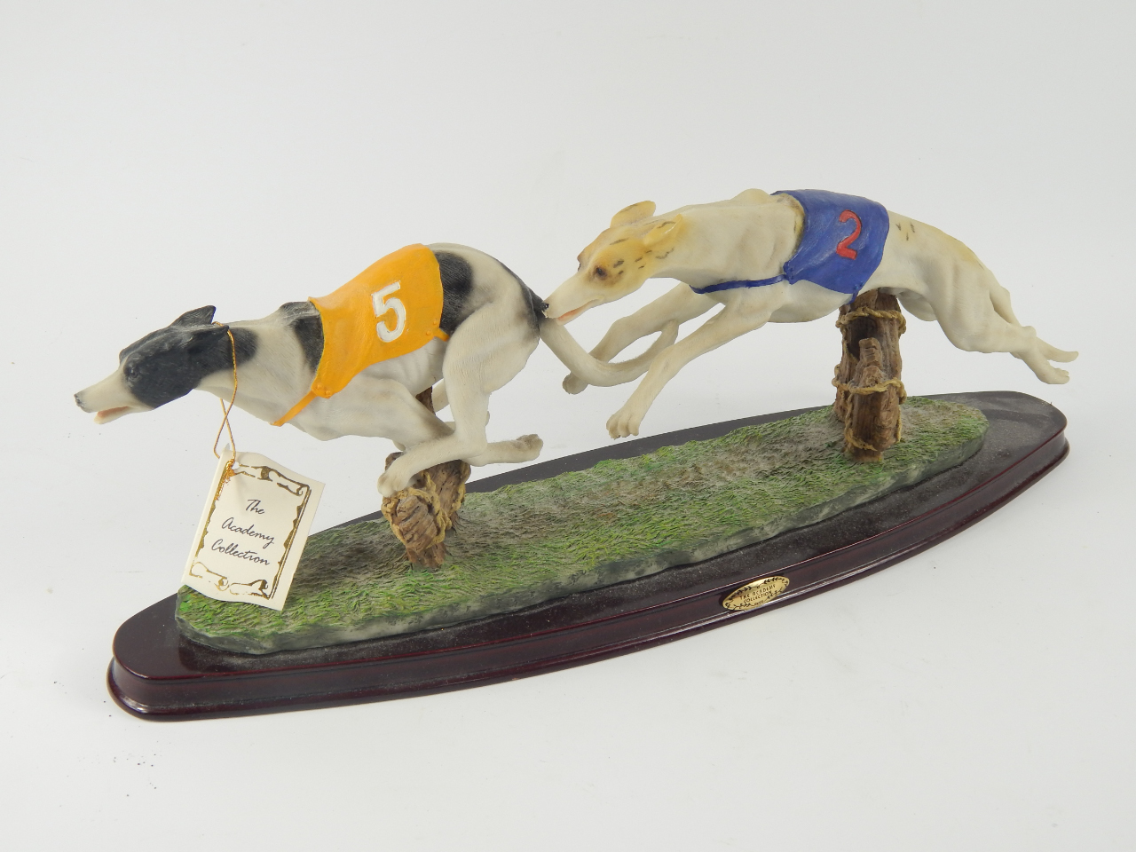 Appraisal: An Academy Collection Sculpture of two racing greyhounds raised on