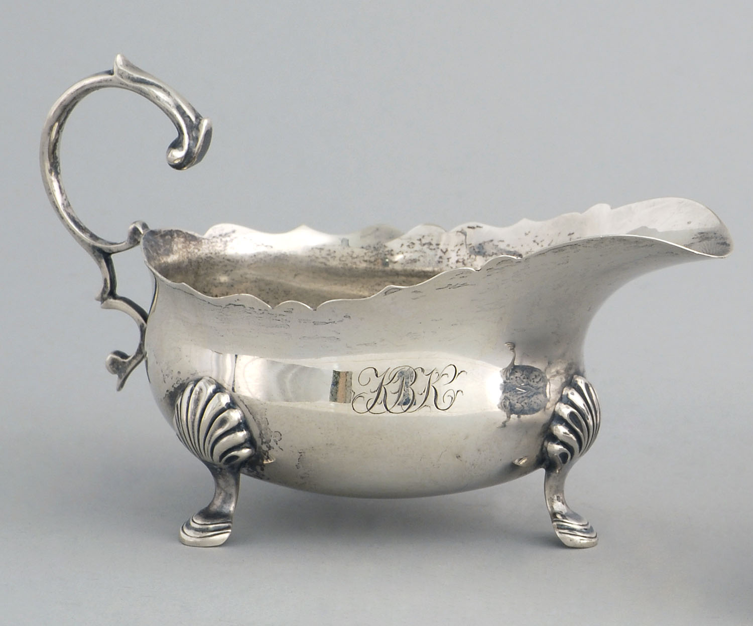 Appraisal: ENGLISH SILVER SAUCEBOAT London Made by Edward Barnard Sons Ltd