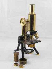 Appraisal: A brass microscope J Swift Son London complete with three