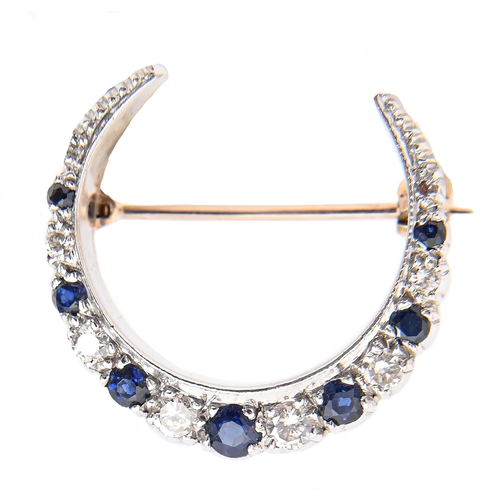 Appraisal: A sapphire and diamond crescent brooch in ct white gold