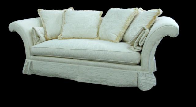 Appraisal: Baker Furniture sofa with ivory brocade upholstery with rolled arms