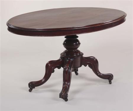 Appraisal: A Victorian mahogany oval centre table the moulded top raised