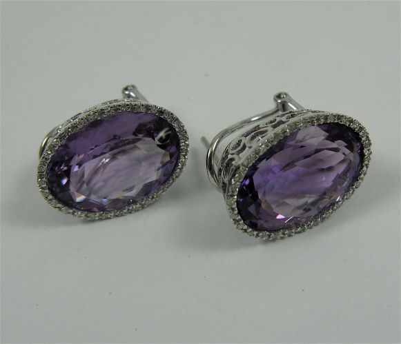 Appraisal: PAIR OF AMETHYST DIAMOND AND K GOLD EARRINGS Each white