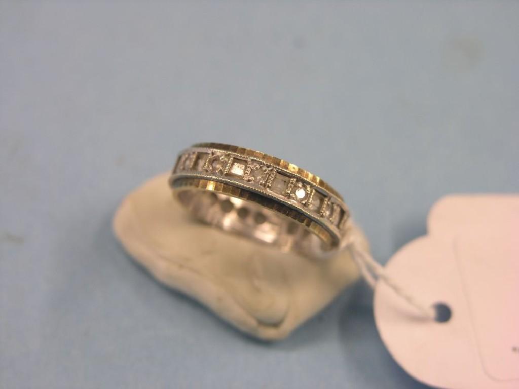 Appraisal: A ct two-colour gold and diamond eternity ring ring size