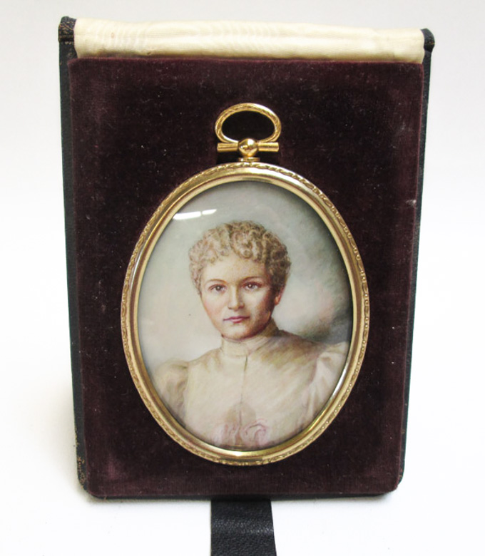 Appraisal: HAND PAINTED MINIATURE PORTRAIT OF A WOMAN with roses and