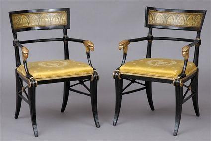 Appraisal: PAIR OF REGENCY-STYLE BLACK LACQUER ARMCHAIRS Each curved top rail