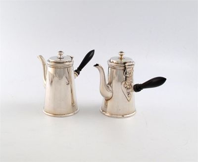 Appraisal: A pair of silver cafe au lait pots by The