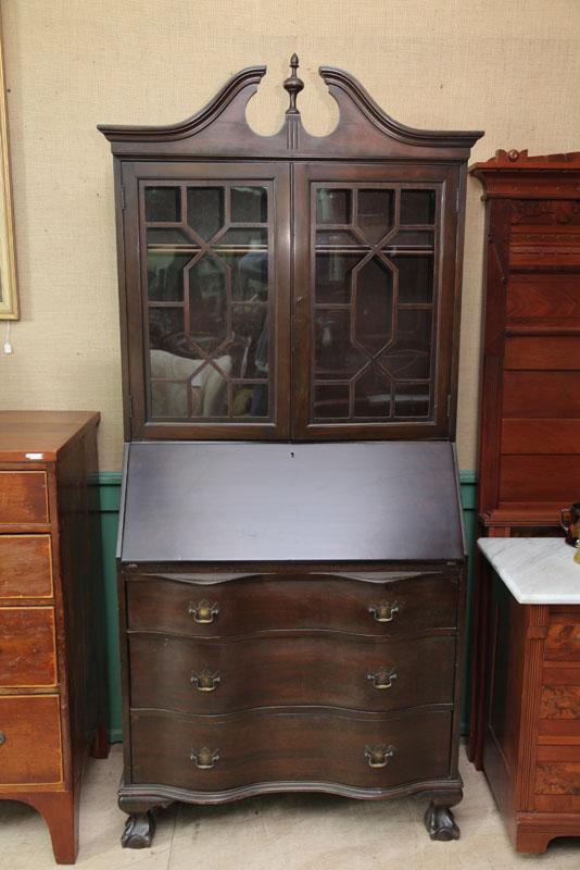 Appraisal: SECRETARY BOOKCASE One piece mahogany with broken arch pediment glazed