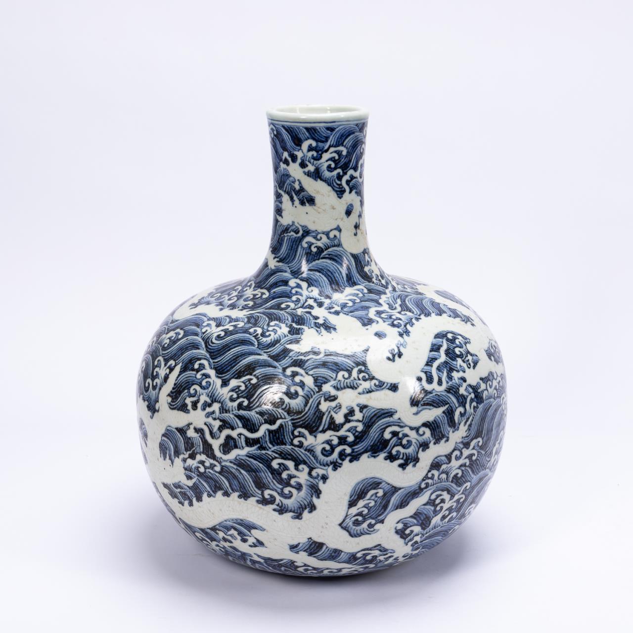 Appraisal: CHINESE BLUE WHITE DRAGON WAVE BOTTLE VASE Chinese blue and