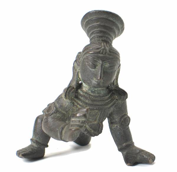 Appraisal: A small Indian bronze of Krishna as the butter thief