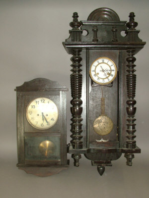 Appraisal: A Continental wooden cased regulator type wall clock with turned