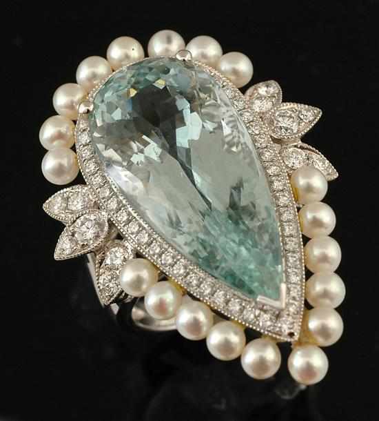 Appraisal: An aquamarine diamond and pearl dress ring Centrally set with