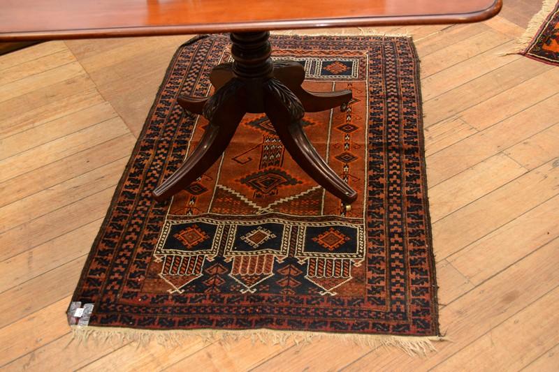 Appraisal: TWO SMALL RUGS ONE PERSIAN IN BLUE AND RED TONES