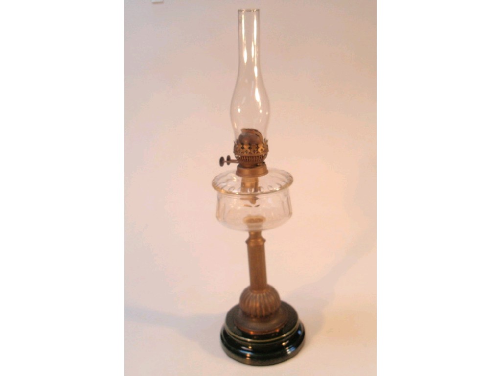 Appraisal: A Victorian oil lamp with green glaze pottery base glass