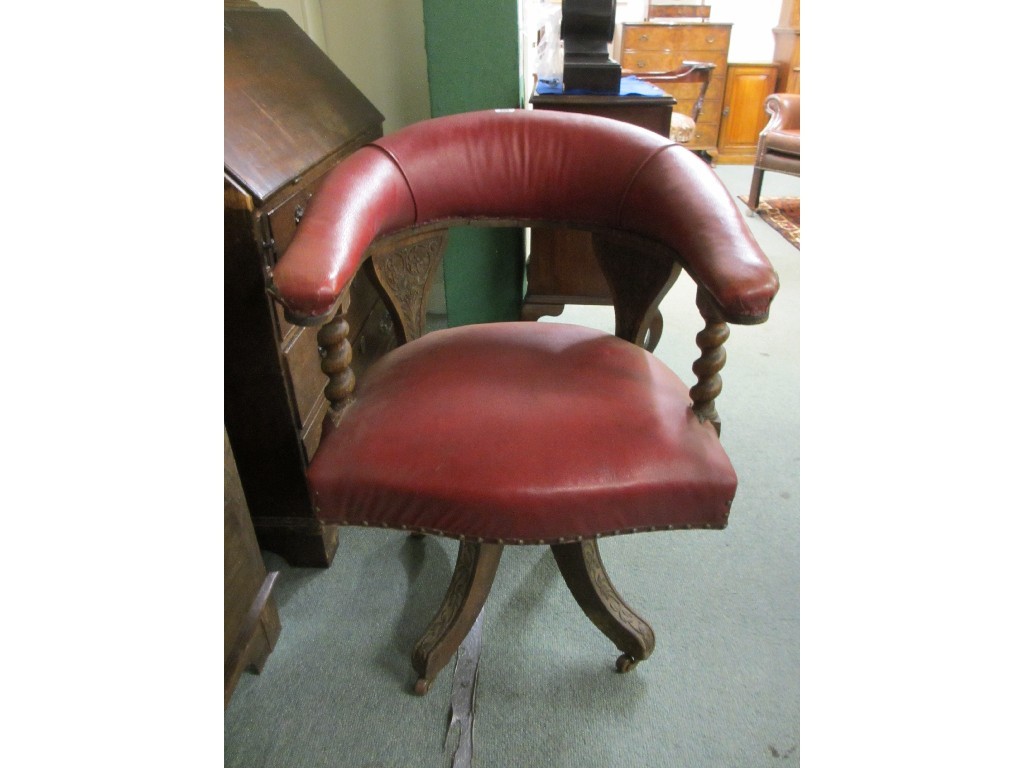 Appraisal: Edwardian oak swivel desk armchair