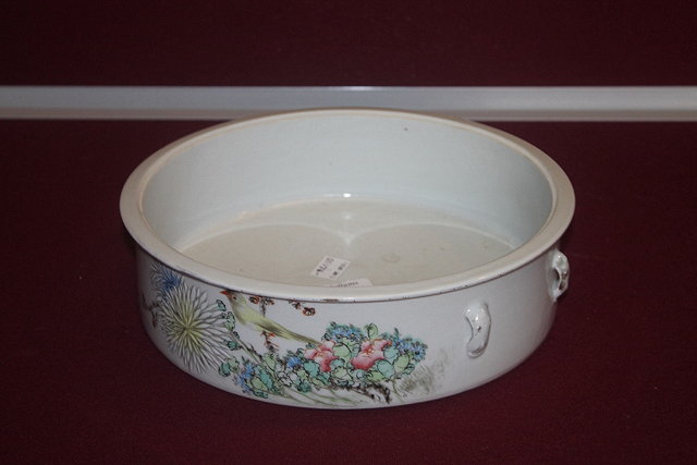 Appraisal: A CHINESE POLYCHROME CIRCULAR BOWL painted with a budgerigar and