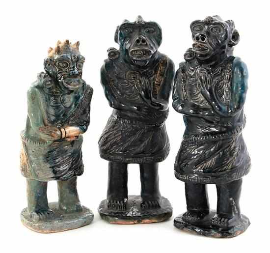 Appraisal: Chinese demon figures possibly roof tiles late Qing Dynasty blue-glazed