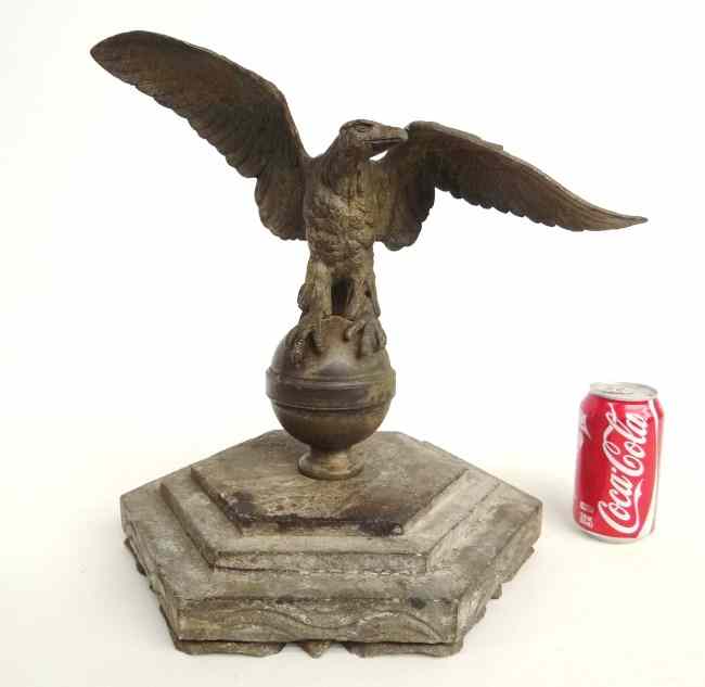 Appraisal: Decorative cast iron eagle on stone base '' Wing Span