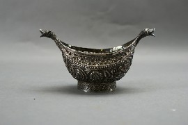 Appraisal: An Iranian silver kashkul or dervish's pierced begging bowl cm