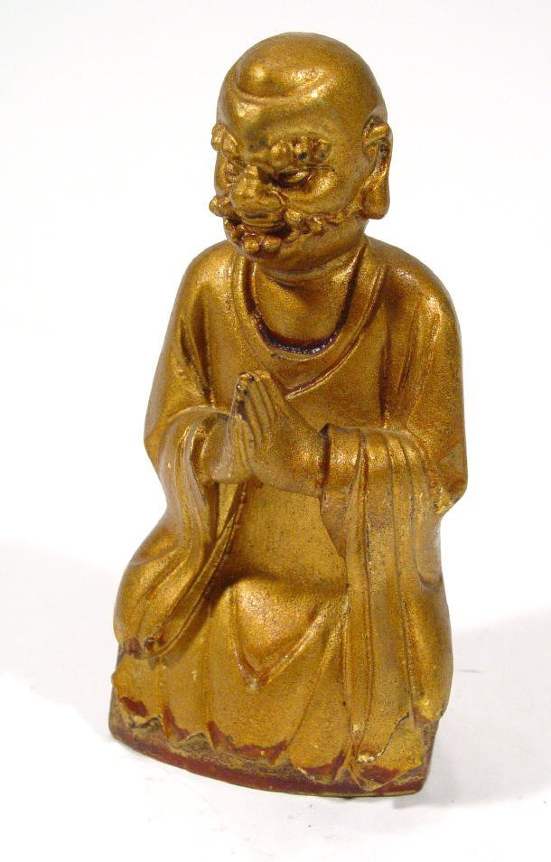 Appraisal: Oriental gilded and carved wooden praying figure cm high