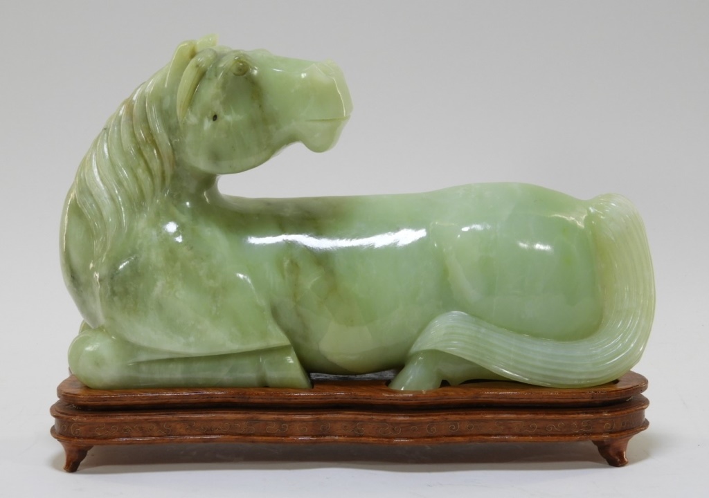 Appraisal: CHINESE CARVED JADE SCULPTURE OF RECUMBENT HORSE China th CenturyNaturalistically