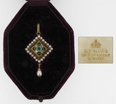 Appraisal: A small Victorian holbeinesque pendant Centred with an emerald between