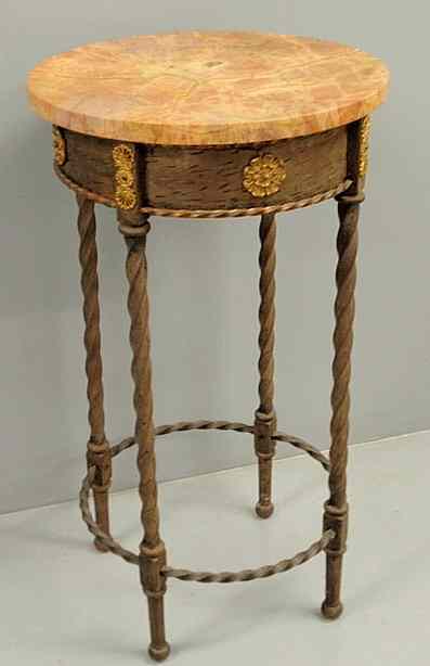 Appraisal: French iron table with a round marble top and dor