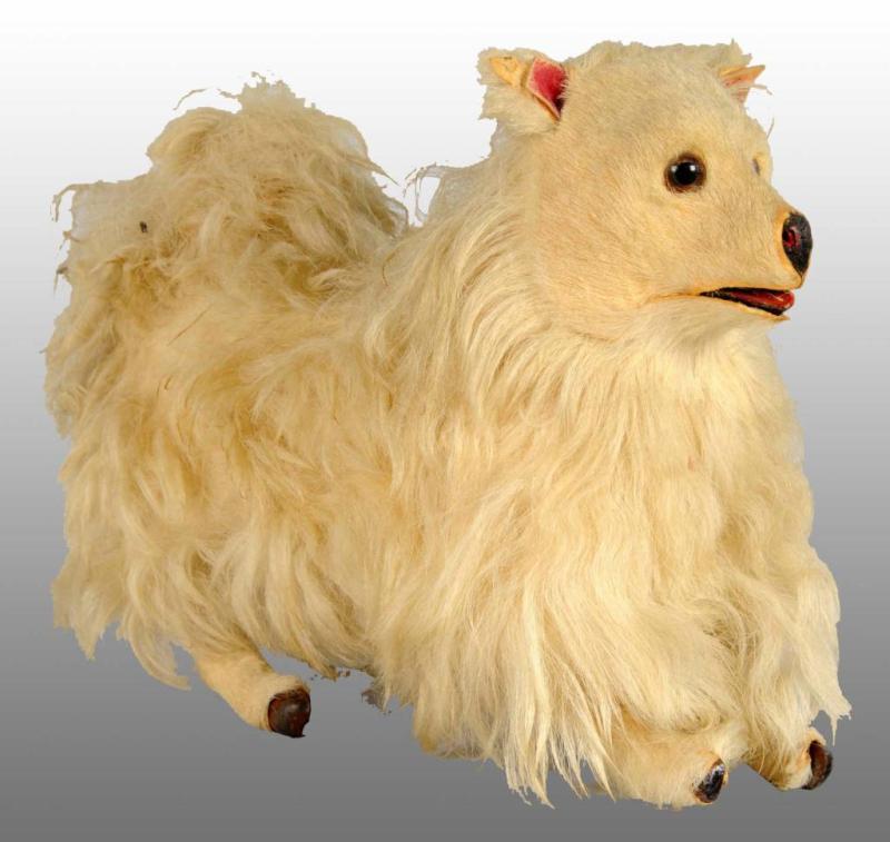 Appraisal: De Camp Clockwork Long Hair Dog Toy Description Fur-covered Working