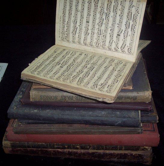 Appraisal: A bound folio of sheet music the cover with embossed