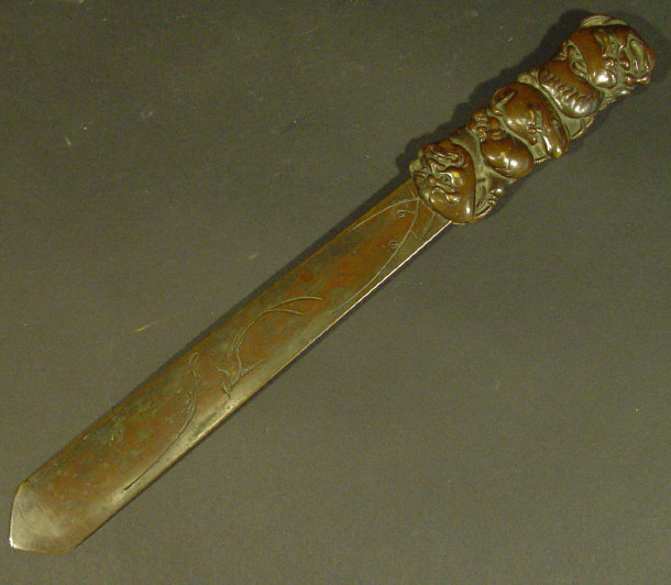 Appraisal: Japanese bronze page turner the handle cast in relief with