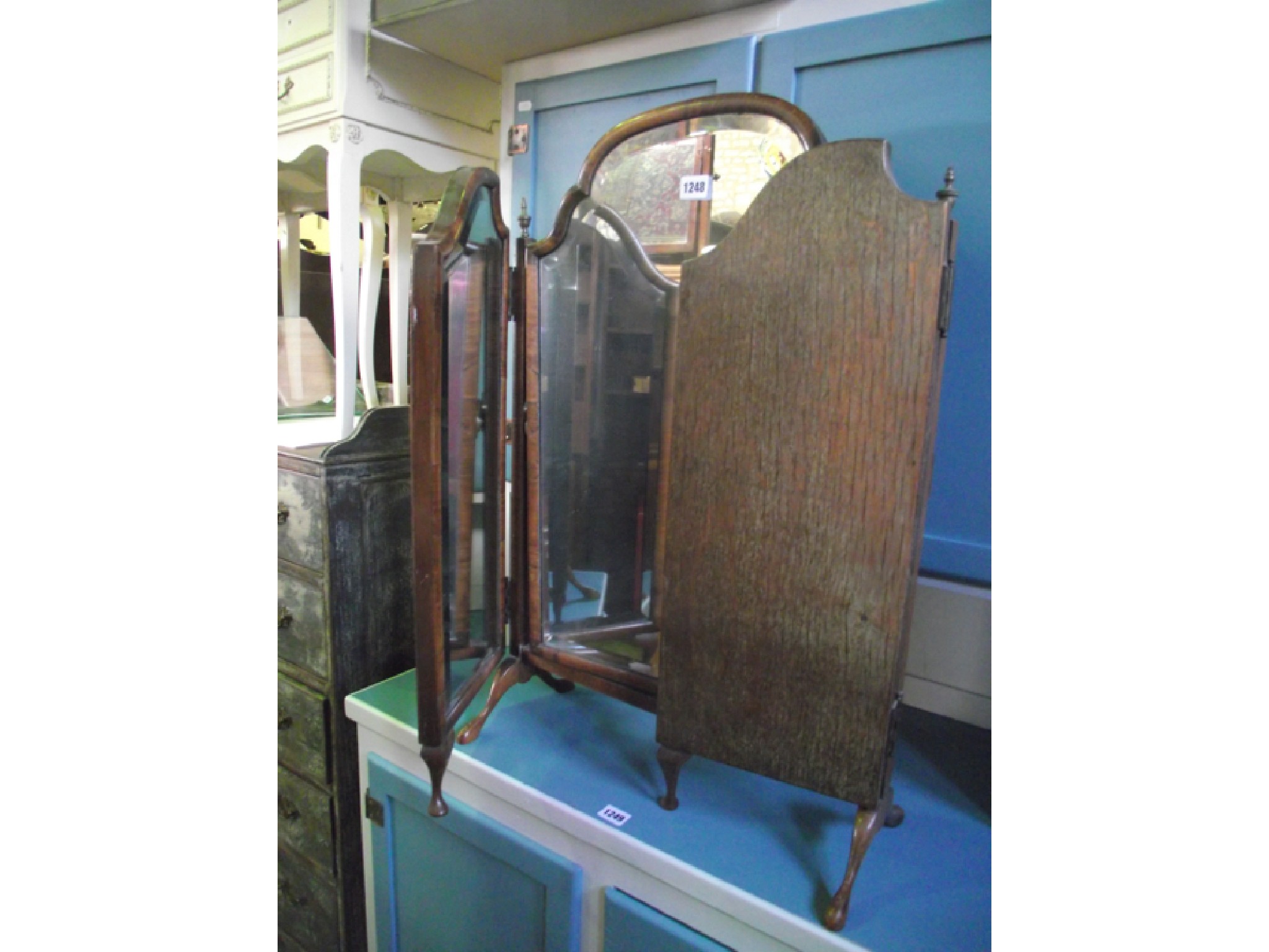 Appraisal: A Queen Anne style walnut framed triple toilet mirror with