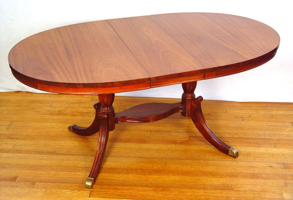 Appraisal: MAHOGANY OVAL DINING TABLE Jefferson Woodworking Co double pedestal supported