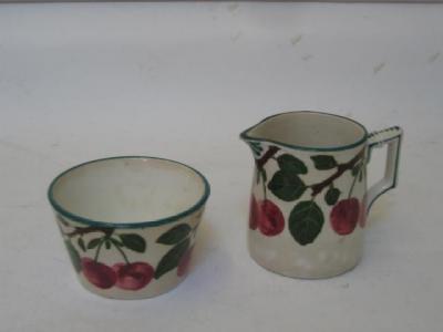 Appraisal: A WEMYSS POTTERY SUGAR AND CREAM early th century of