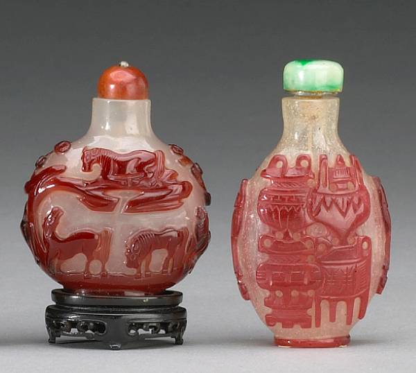 Appraisal: Two red-overlay decorated Peking glass snuff bottles The first a