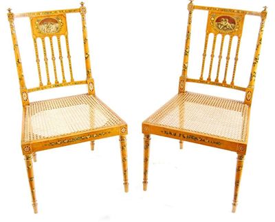 Appraisal: A pair of Sheraton revival side chairs painted with putti